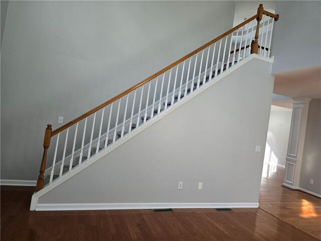 3773 Summer Rose Dr, Atlanta, GA 30341 - stairway with wood finished floors, decorative columns, baseboards, and a towering ceiling