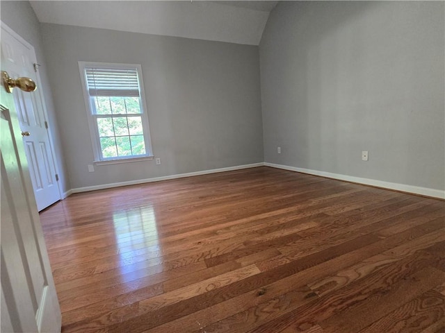 3773 Summer Rose Dr, Atlanta, GA 30341 - spare room featuring wood finished floors, baseboards, and lofted ceiling
