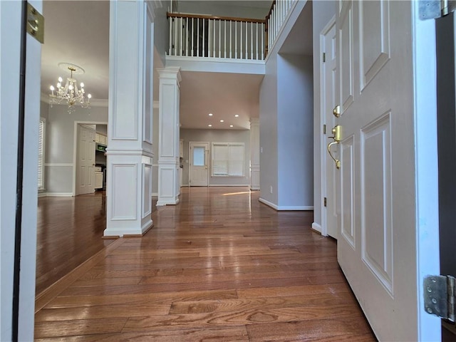 3773 Summer Rose Dr, Atlanta, GA 30341 - foyer entrance featuring decorative columns, wood finished floors, baseboards, a chandelier, and recessed lighting