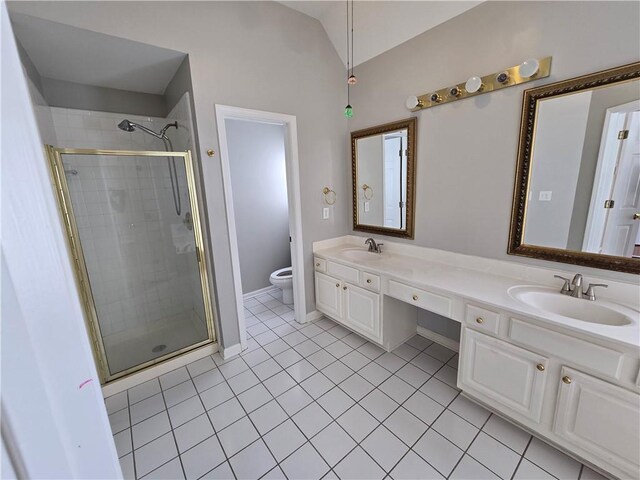 3773 Summer Rose Dr, Atlanta, GA 30341 - bathroom with toilet, a shower stall, double vanity, tile patterned floors, and vaulted ceiling