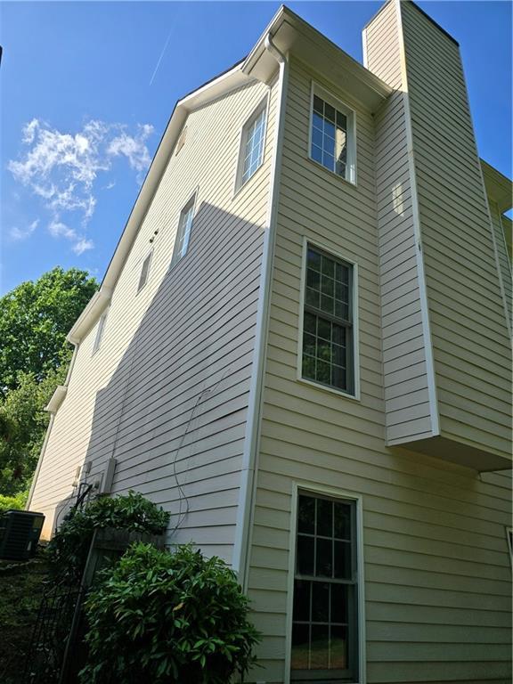 3773 Summer Rose Dr, Atlanta, GA 30341 - view of side of home with a chimney and central air condition unit
