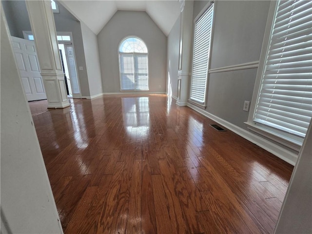 3773 Summer Rose Dr, Atlanta, GA 30341 - spare room with decorative columns, vaulted ceiling, dark wood-style flooring, and baseboards