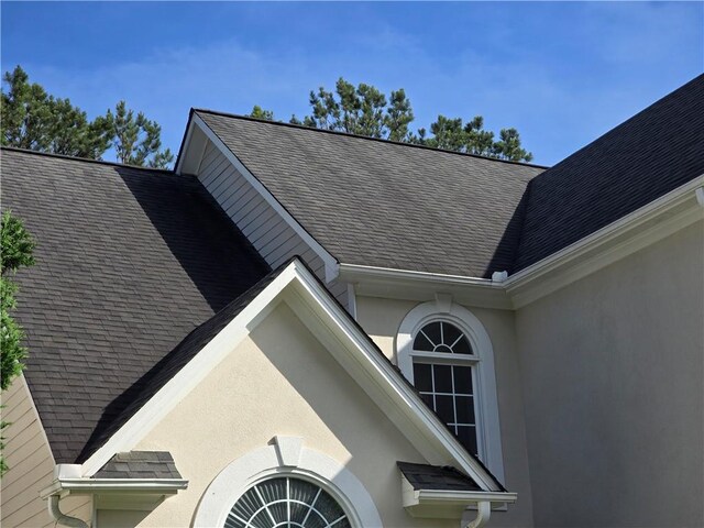 3773 Summer Rose Dr, Atlanta, GA 30341 - exterior view of gutters, a downspout, and stucco siding