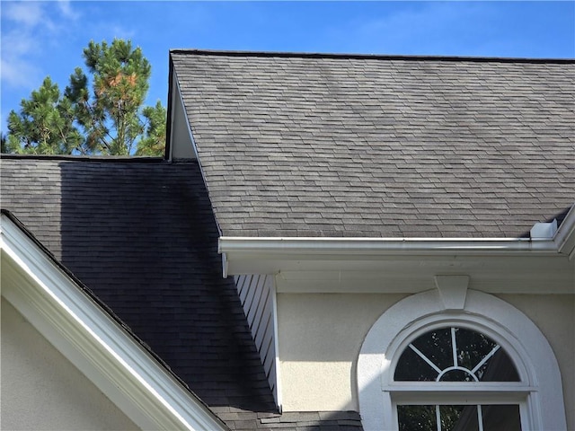 3773 Summer Rose Dr, Atlanta, GA 30341 - detailed view of roof with shingles and stucco siding