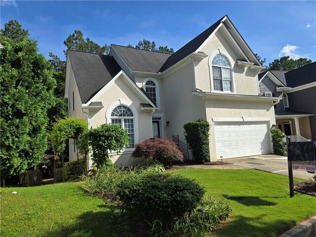 3773 Summer Rose Dr, Atlanta, GA 30341 - view of front facade with stucco siding, a front lawn, and concrete driveway