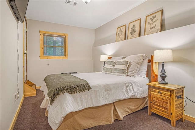 bedroom featuring baseboards, visible vents, and carpet floors