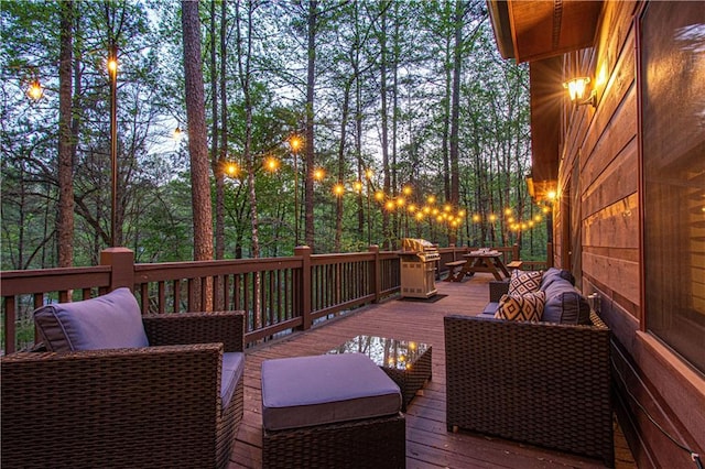 wooden terrace featuring an outdoor hangout area