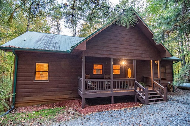 rustic home featuring metal roof