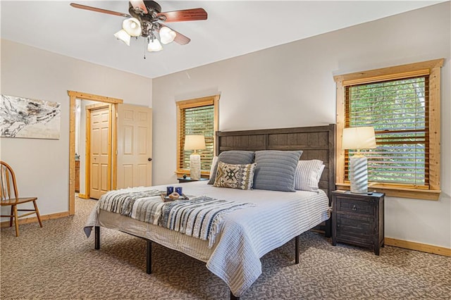 bedroom with carpet flooring, a ceiling fan, and baseboards