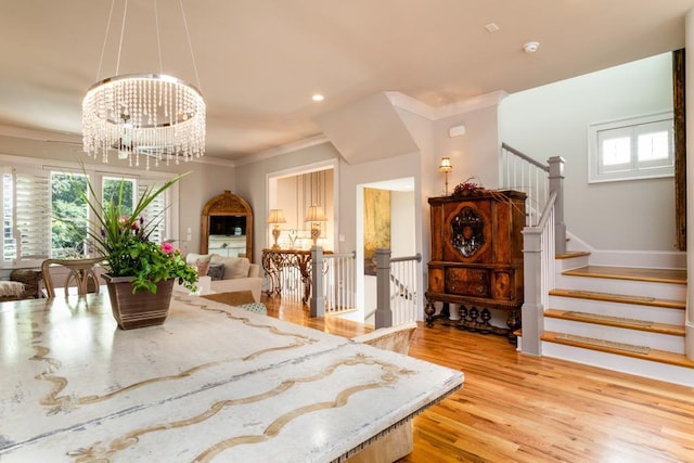 3734 Paige Way NE Unit 10, Atlanta, GA 30319 - dining room with light wood finished floors, ornamental molding, a chandelier, stairs, and recessed lighting