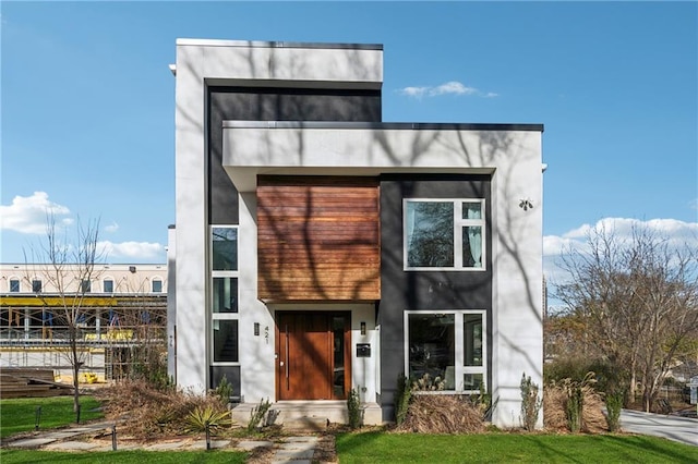 modern home with a front yard