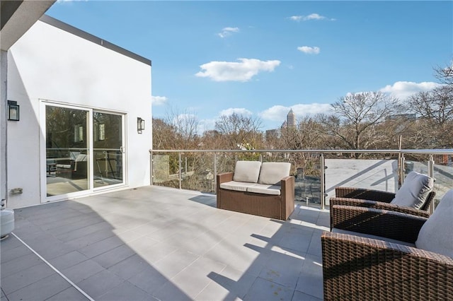 view of patio featuring a balcony