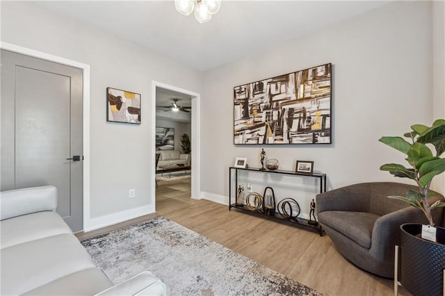 living area with hardwood / wood-style flooring