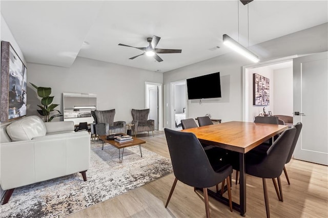 dining space featuring light hardwood / wood-style flooring and ceiling fan