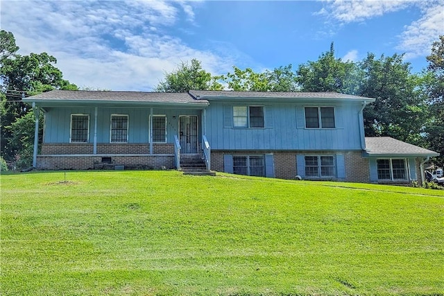 2175 Surrey Trl, Atlanta, GA 30349 - view of front facade featuring a front yard, covered porch, and brick siding