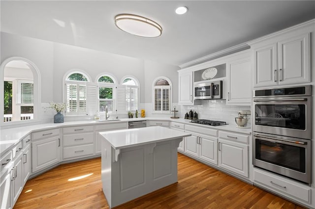 14270 Morning Mountain Way, Milton, GA 30004 - kitchen with stainless steel appliances, tasteful backsplash, white cabinets, light countertops, and recessed lighting