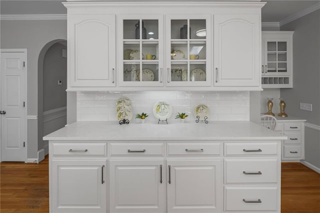 14270 Morning Mountain Way, Milton, GA 30004 - bar area featuring arched walkways, ornamental molding, dark wood finished floors, and backsplash