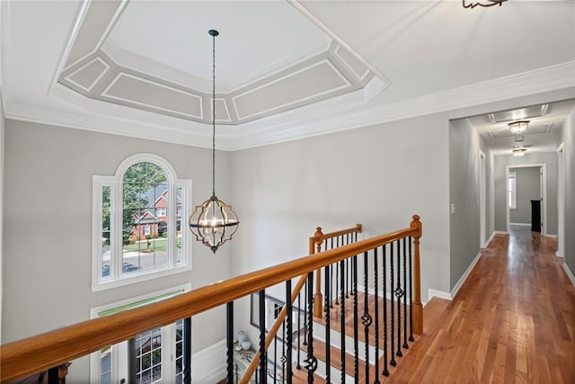 14270 Morning Mountain Way, Milton, GA 30004 - corridor featuring wood finished floors, a chandelier, an upstairs landing, and crown molding