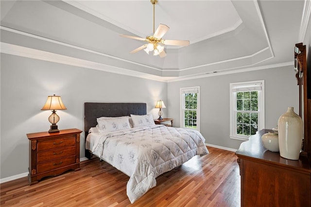 14270 Morning Mountain Way, Milton, GA 30004 - bedroom featuring a raised ceiling, wood finished floors, a ceiling fan, and crown molding