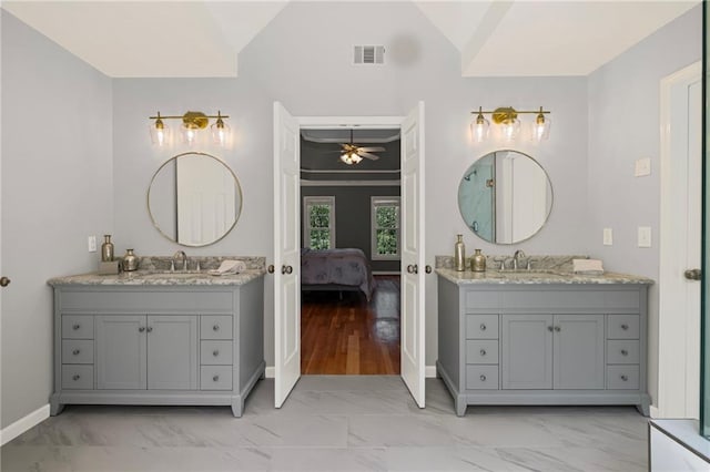 14270 Morning Mountain Way, Milton, GA 30004 - bathroom with marble look tiles, two vanities, ensuite bath, a ceiling fan, and vaulted ceiling