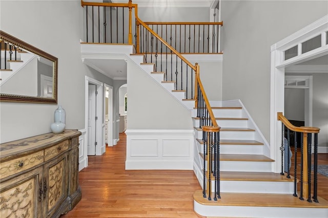 14270 Morning Mountain Way, Milton, GA 30004 - stairs with wood finished floors, arched walkways, a high ceiling, and crown molding