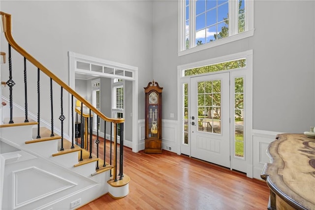 14270 Morning Mountain Way, Milton, GA 30004 - entryway featuring a high ceiling, plenty of natural light, wood finished floors, a decorative wall, and wainscoting