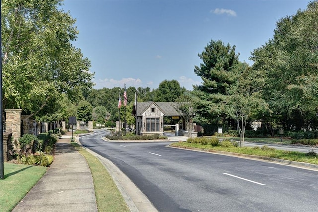 14270 Morning Mountain Way, Milton, GA 30004 - view of asphalt road featuring sidewalks, curbs, and view of scattered trees