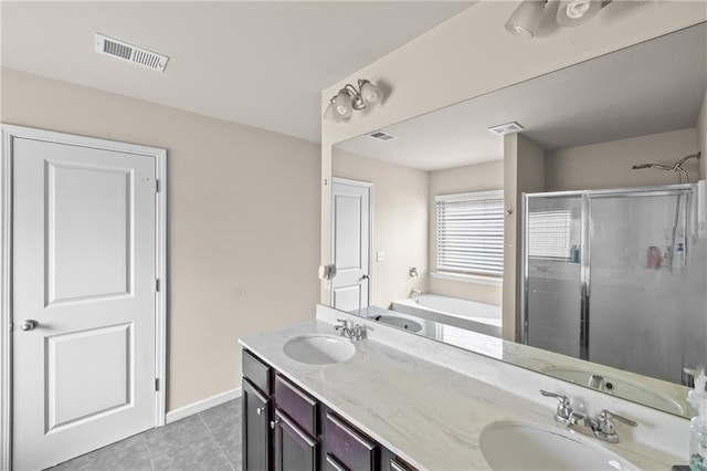 133 Worthing Ln, Fairburn, GA 30213 - bathroom featuring a stall shower, a garden tub, tile patterned flooring, and double vanity