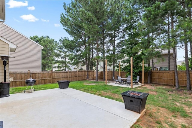 133 Worthing Ln, Fairburn, GA 30213 - fenced backyard featuring a patio area, an outdoor fire pit, and a grill