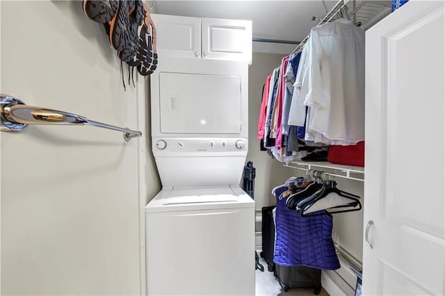 laundry room with stacked washer / drying machine