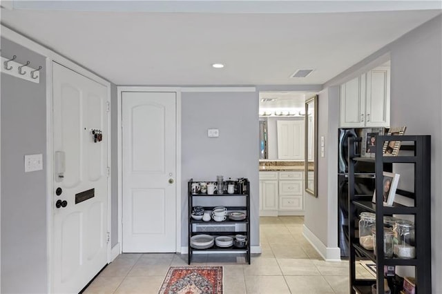 interior space featuring light tile patterned floors