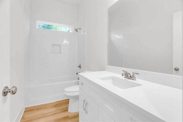 614 Glendale Rd, Scottdale, GA 30079 - full bathroom with toilet, wood finished floors, vanity, and bathtub / shower combination