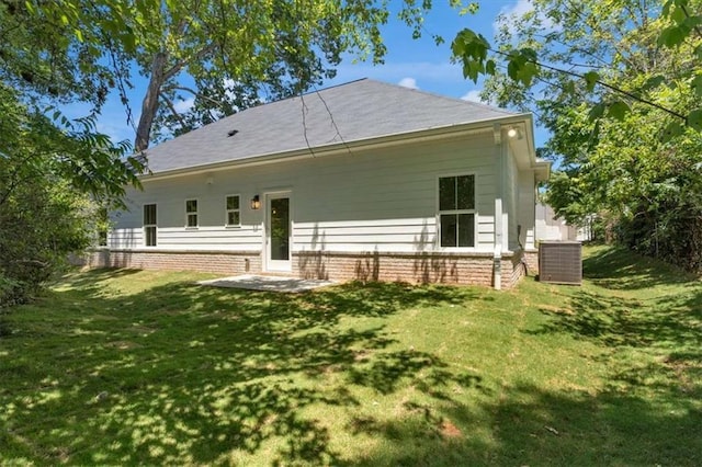 614 Glendale Rd, Scottdale, GA 30079 - rear view of house with cooling unit, a lawn, and brick siding