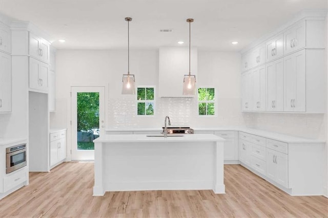 614 Glendale Rd, Scottdale, GA 30079 - kitchen with tasteful backsplash, healthy amount of natural light, light countertops, and recessed lighting