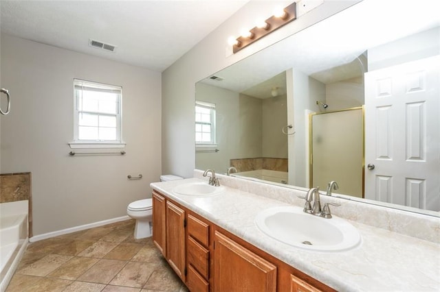 4400 Old Allgood Cir, Stone Mountain, GA 30083 - full bathroom featuring baseboards, a garden tub, a shower with shower door, double vanity, and toilet