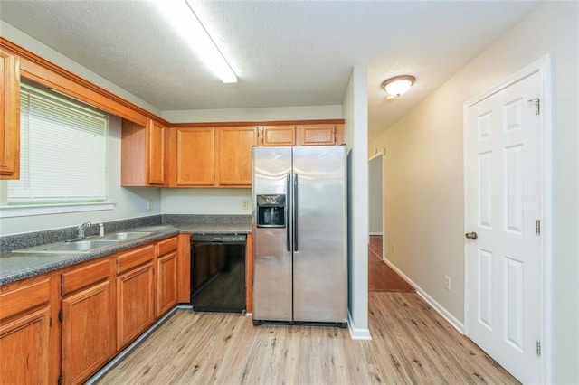 4400 Old Allgood Cir, Stone Mountain, GA 30083 - kitchen featuring stainless steel fridge with ice dispenser, dishwasher, light wood-style flooring, and dark countertops