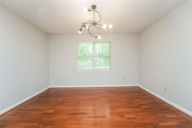 4400 Old Allgood Cir, Stone Mountain, GA 30083 - spare room with a chandelier, wood finished floors, and baseboards
