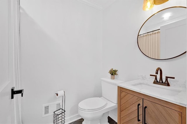 597 Rich Davis Rd, Hiram, GA 30141 - bathroom featuring vanity, toilet, ornamental molding, and baseboards