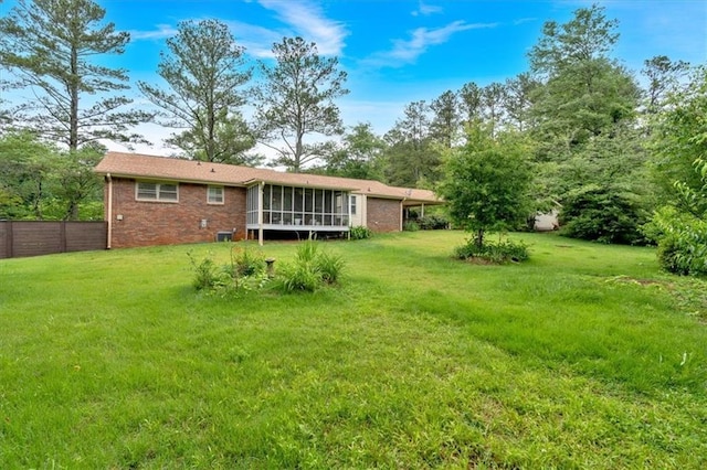 597 Rich Davis Rd, Hiram, GA 30141 - back of property featuring a sunroom and brick siding