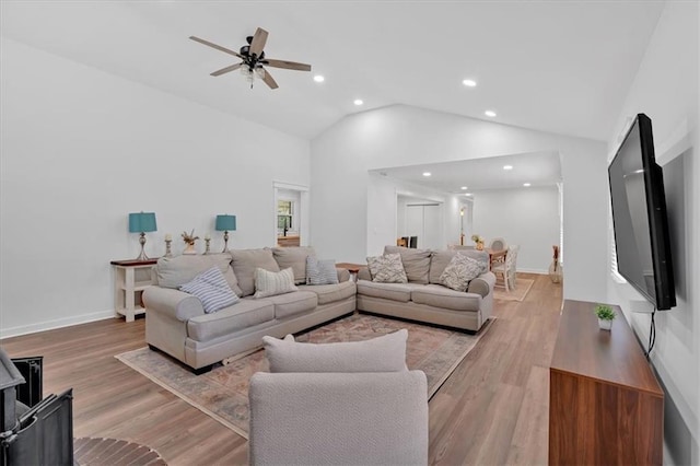 597 Rich Davis Rd, Hiram, GA 30141 - living room featuring recessed lighting, a ceiling fan, light wood finished floors, high vaulted ceiling, and baseboards