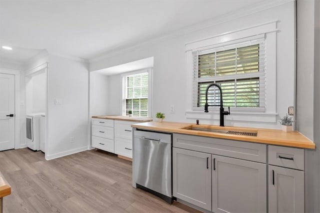 597 Rich Davis Rd, Hiram, GA 30141 - kitchen with dishwasher, butcher block counters, a sink, crown molding, and light wood finished floors