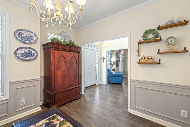 49 Inverness Ct, Hiram, GA 30141 - foyer entrance featuring crown molding, a chandelier, dark wood-style floors, and wainscoting
