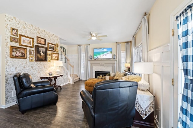 49 Inverness Ct, Hiram, GA 30141 - living room with wallpapered walls, stairway, dark wood-style floors, ceiling fan, and a fireplace