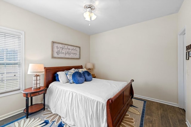 49 Inverness Ct, Hiram, GA 30141 - bedroom with wood finished floors, baseboards, and a ceiling fan