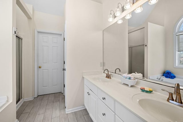 49 Inverness Ct, Hiram, GA 30141 - bathroom featuring a shower stall, double vanity, a garden tub, and wood finish floors