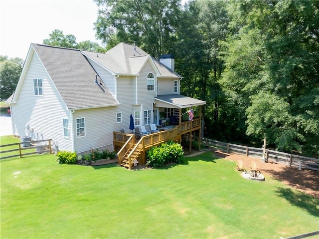 49 Inverness Ct, Hiram, GA 30141 - back of property featuring a wooden deck, stairs, a fenced backyard, and a chimney