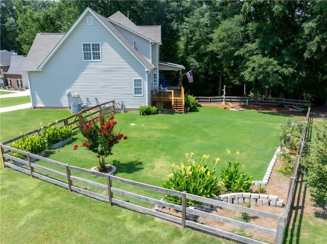 49 Inverness Ct, Hiram, GA 30141 - fenced backyard with a wooden deck and a vegetable garden
