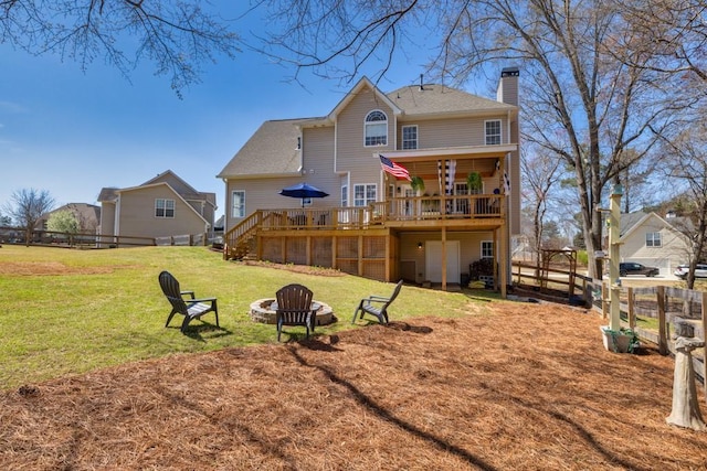 49 Inverness Ct, Hiram, GA 30141 - rear view of house with a wooden deck, a fire pit, a chimney, and stairway
