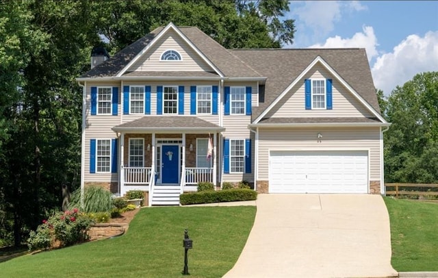 49 Inverness Ct, Hiram, GA 30141 - colonial house featuring covered porch, driveway, and a garage