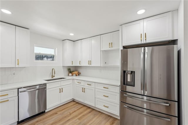 kitchen featuring white cabinetry, appliances with stainless steel finishes, and sink